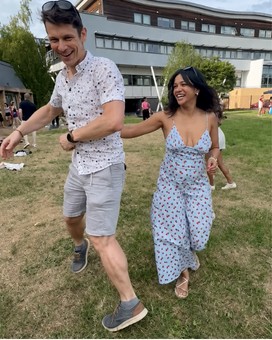 Two people dancing together outdoors