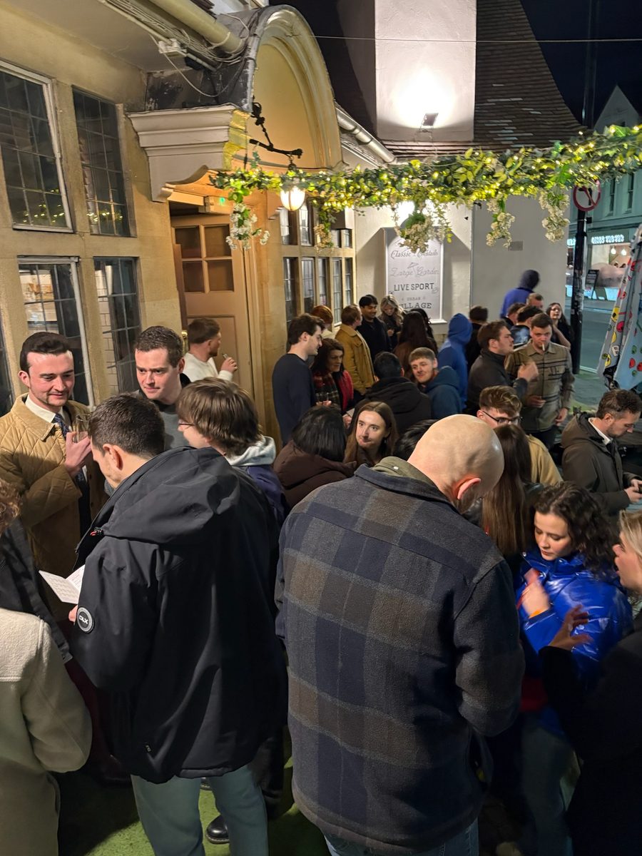 A pub crawl group outside a pub