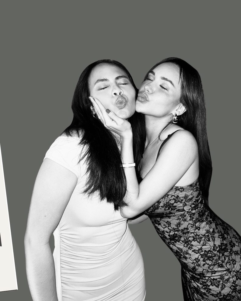 Two people posing with kiss faces at Stupid Cupid