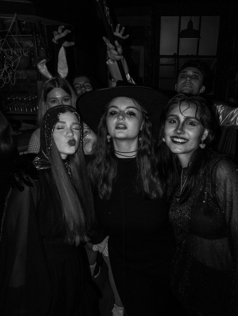A group posing in Halloween costumes at the Halloween Pub Crawl